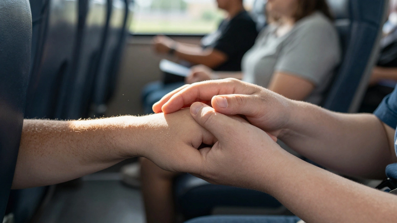 Two hands with different physical differences gently holding each other on a bus seat, soft sunlight filtering through the window.